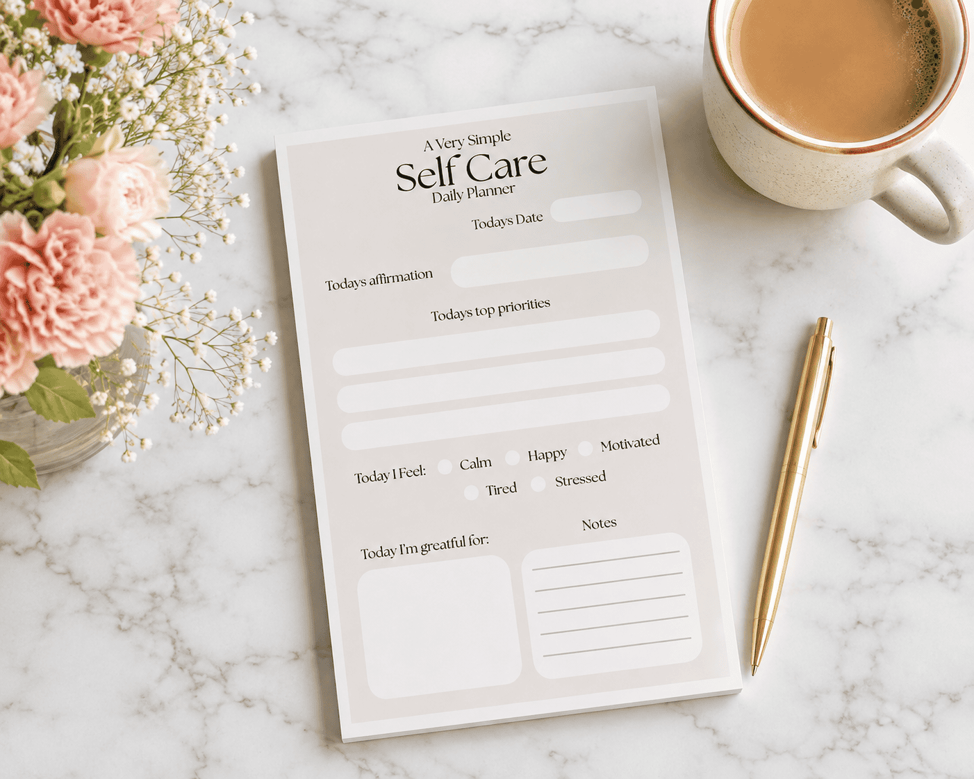 Self care daily planner notepad on desk with coffee and flowers